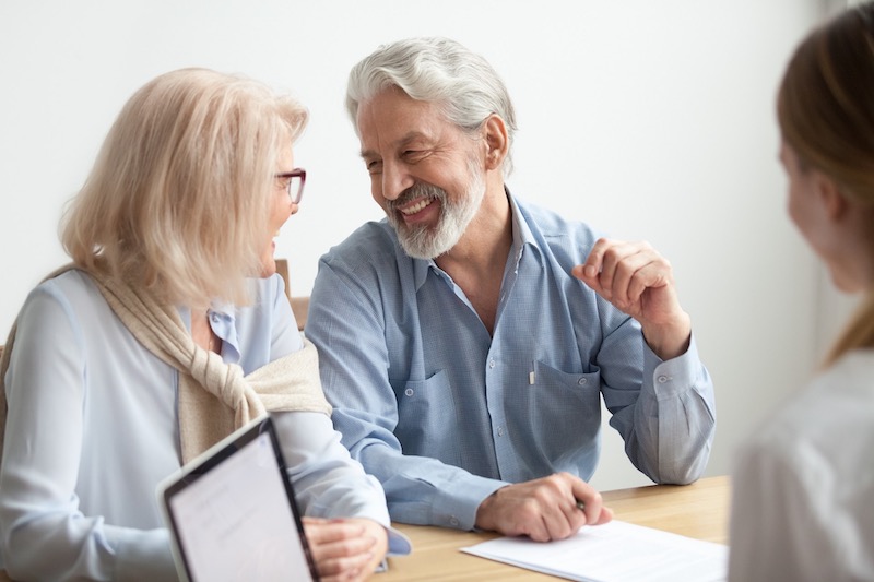 Grandparent Rights Elderly Couple Smiling At Each Other In The Attorneys Office