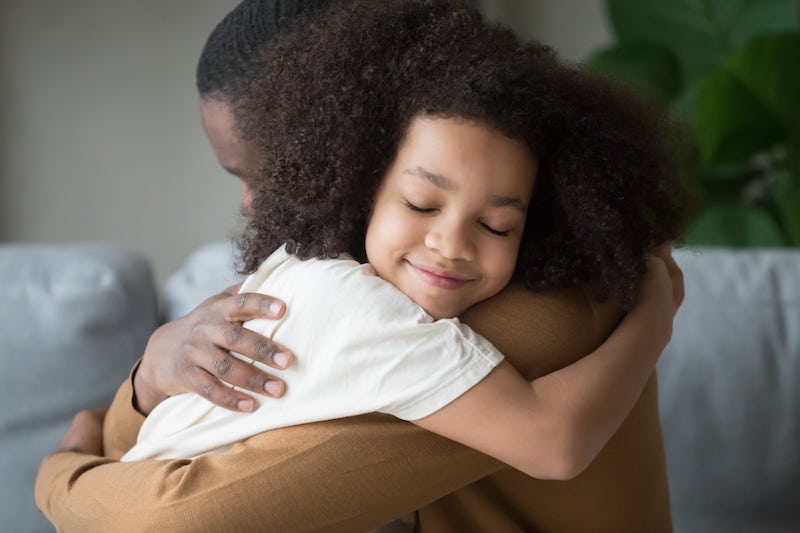 Fatherly Love Child Smiling And Hugging His Father