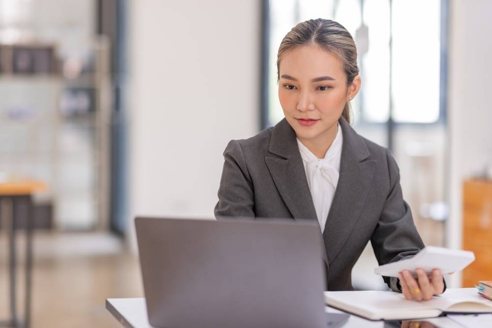 Photo of lady sitting at the desk